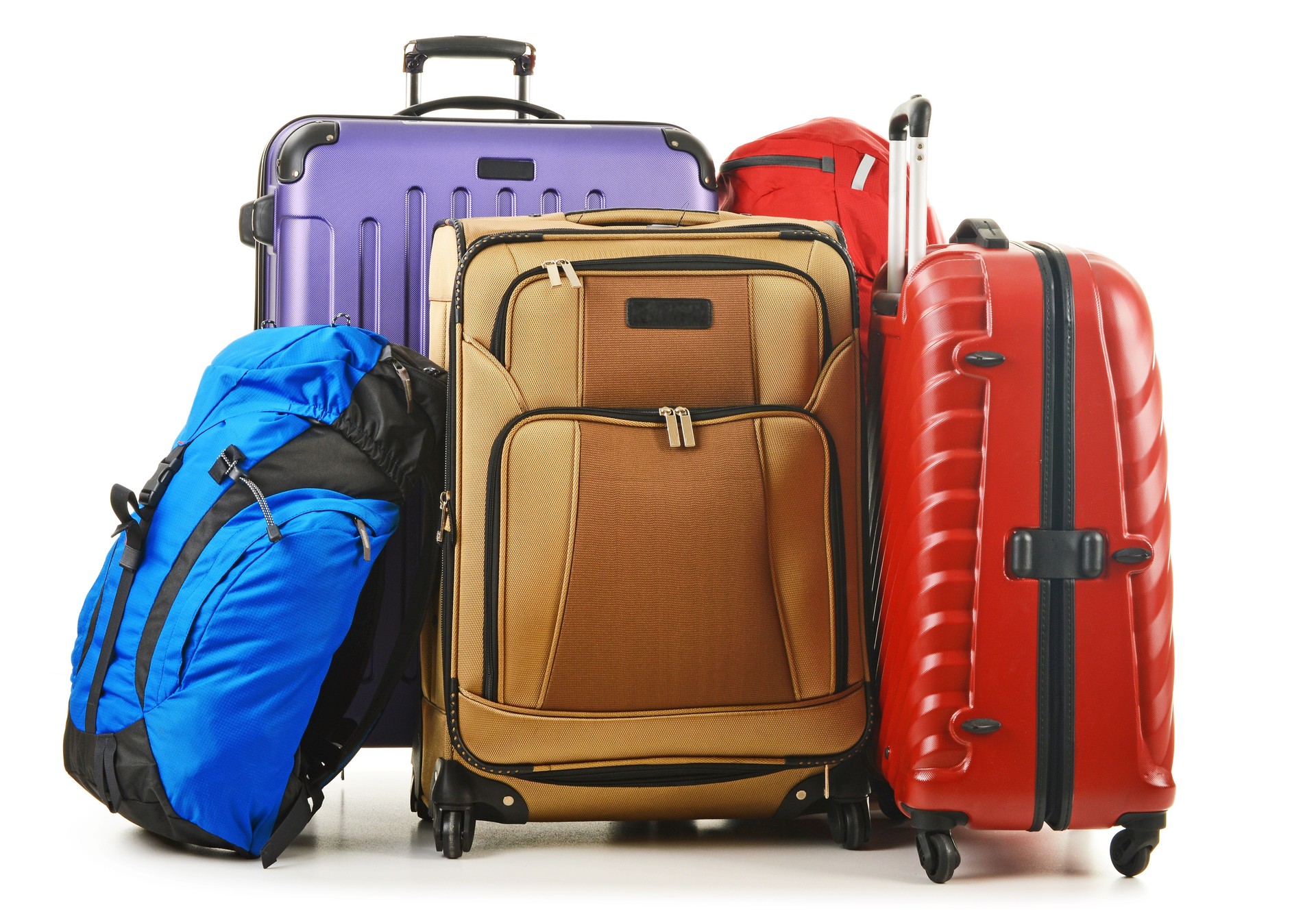 Suitcases and rucksack isolated on white